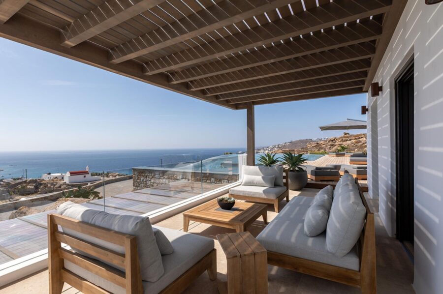 villa-petra-balcony-alfresco-lounge-area-scenic-sea-views-pool-views-luxury-mykonos