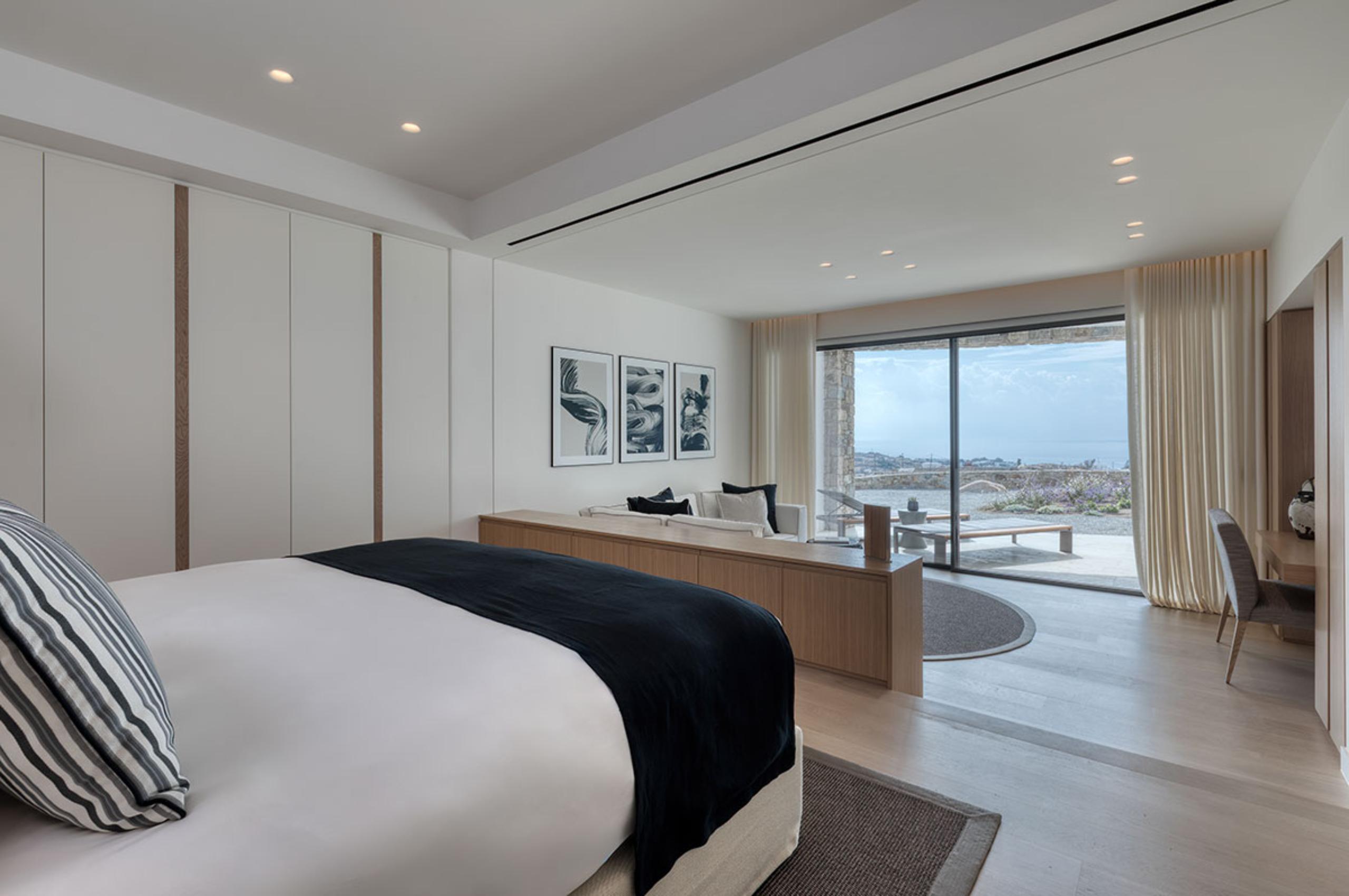 villa-petra-bedroom-scenic-sea-views-desk-lounge-area-serene-modern-interior-luxury-mykonos