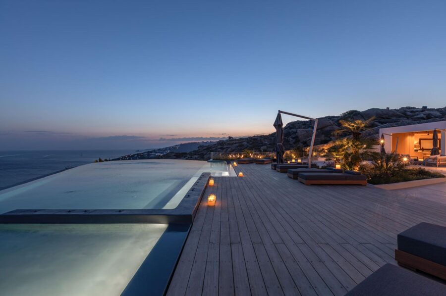 villa-petra-exterior-night-infinity-swimming-pool-terrace-luxury-rental-retreat-mykonos
