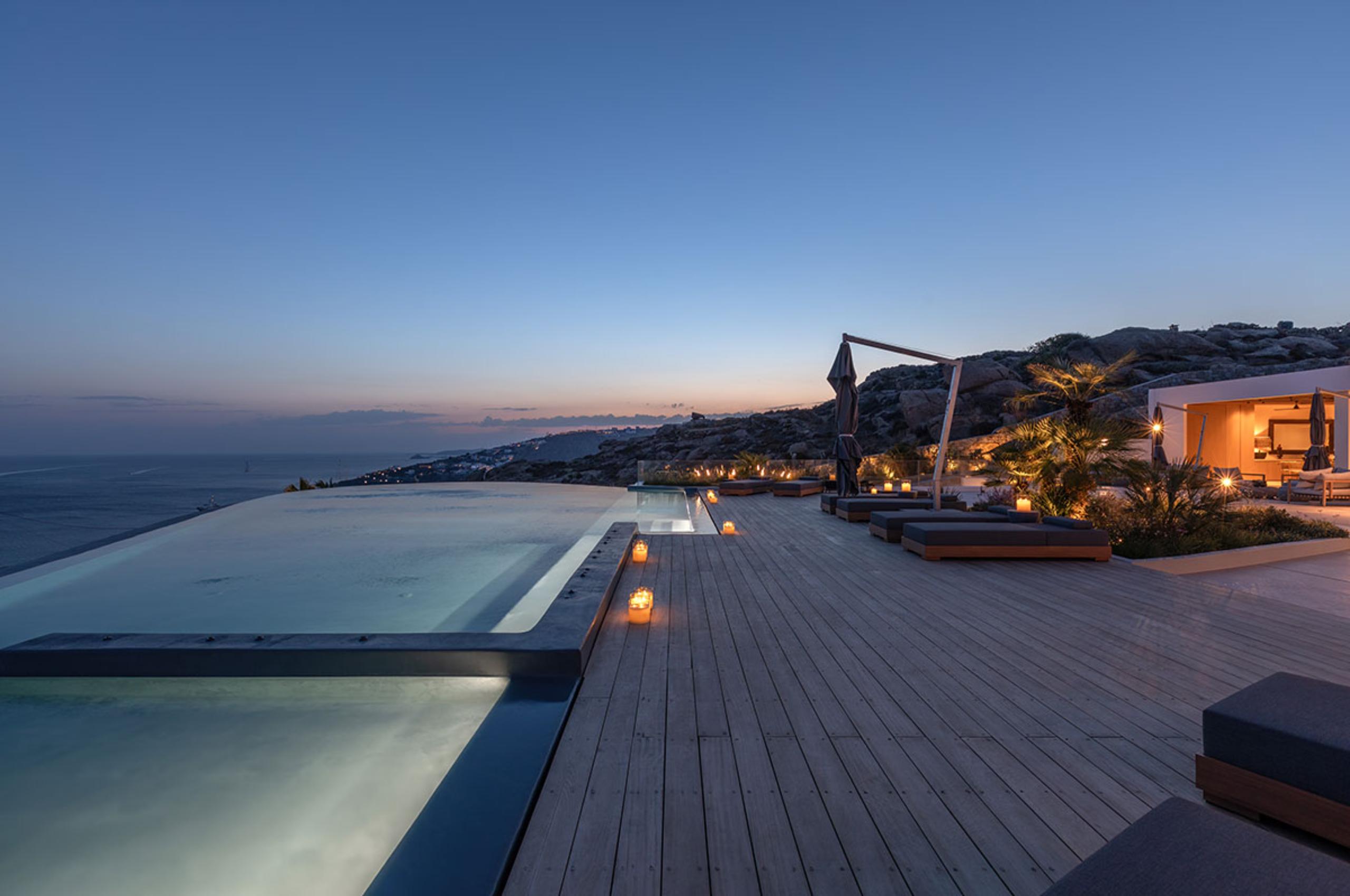villa-petra-exterior-night-infinity-swimming-pool-terrace-luxury-rental-retreat-mykonos
