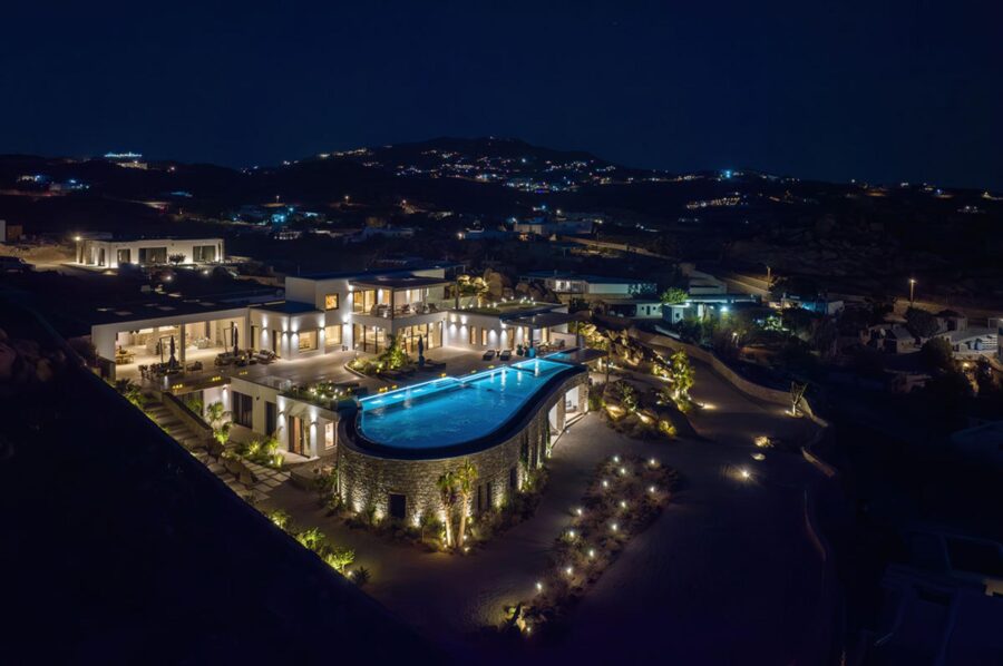 villa-petra-exterior-night-luxury-mediterranean-retreat-swimming-pool-terraces-mykonos
