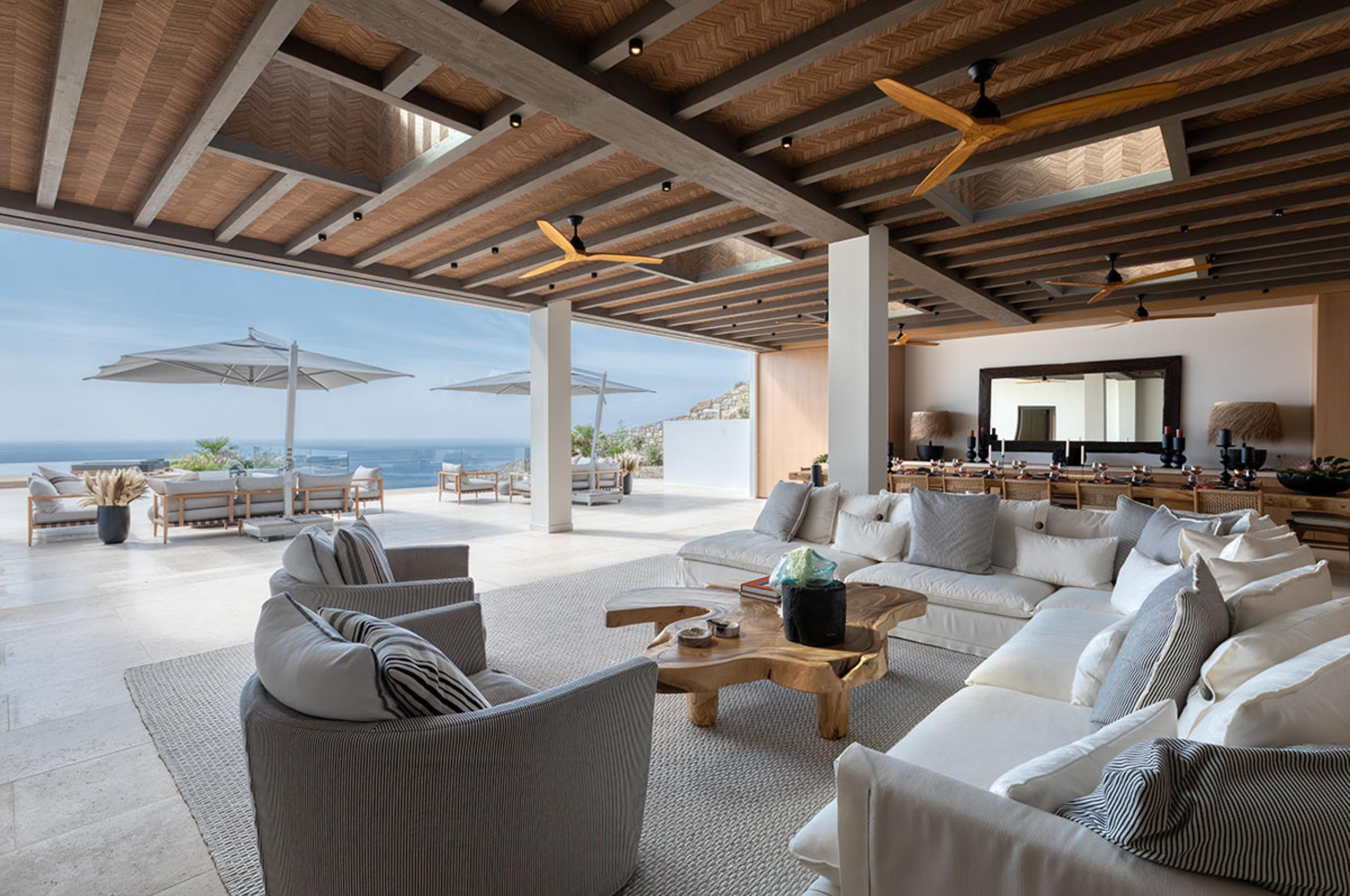 villa-petra-living-area-openplan-scenic-sea-views-terrace-access-indoor-outdoor-living-luxury-mykonos