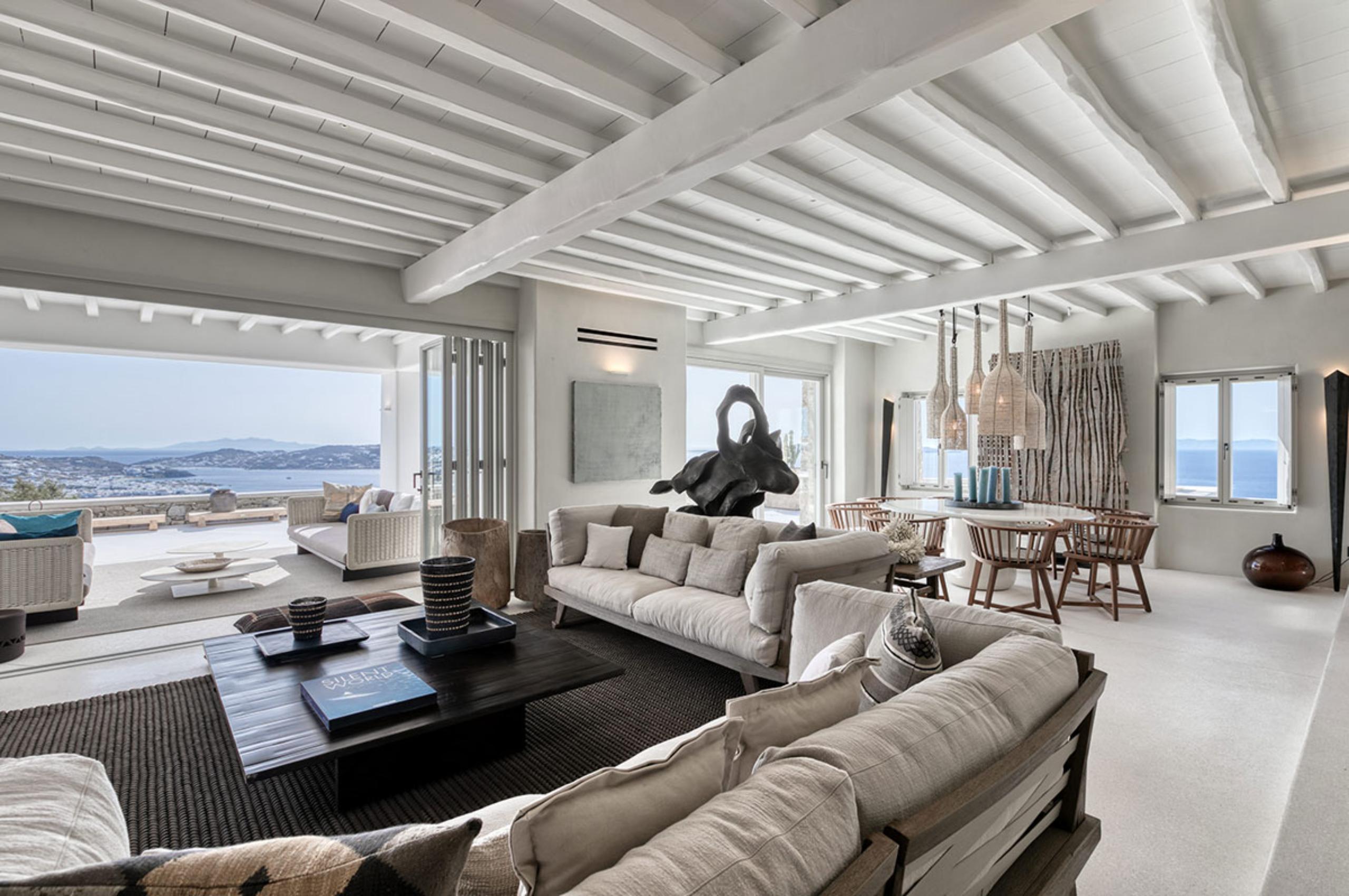 villa-selena-living-room-dining-area-sea-view-openplan-indoor-outdoor-living-luxury-mykonos