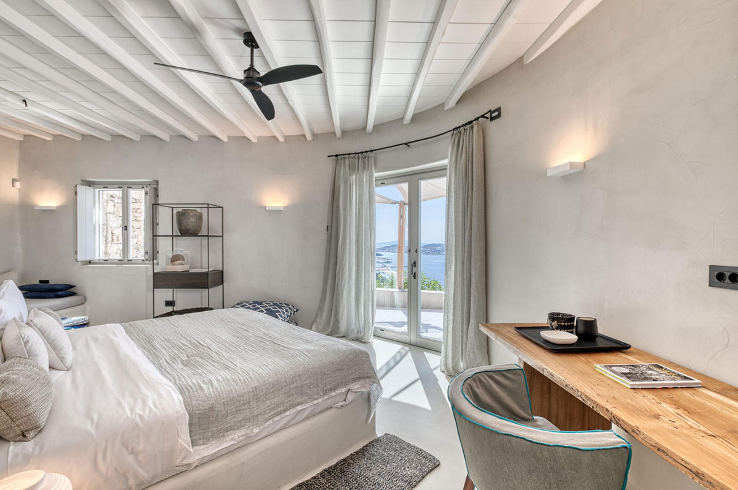 villa-selina-bedroom-sea-view-bright-serene-elegant-interior-design-luxury-mykonos