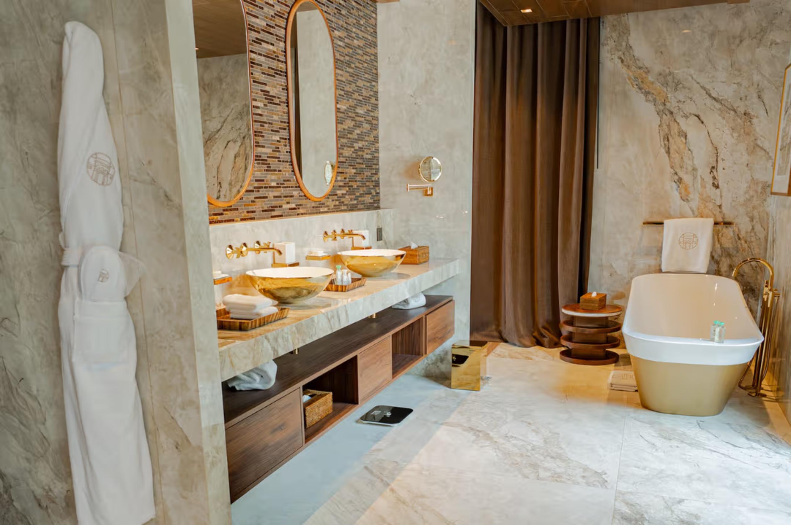 villa-soline-bathroom-bathtub-double-sink-gold-marble-interior-luxury-lacroixvalmer