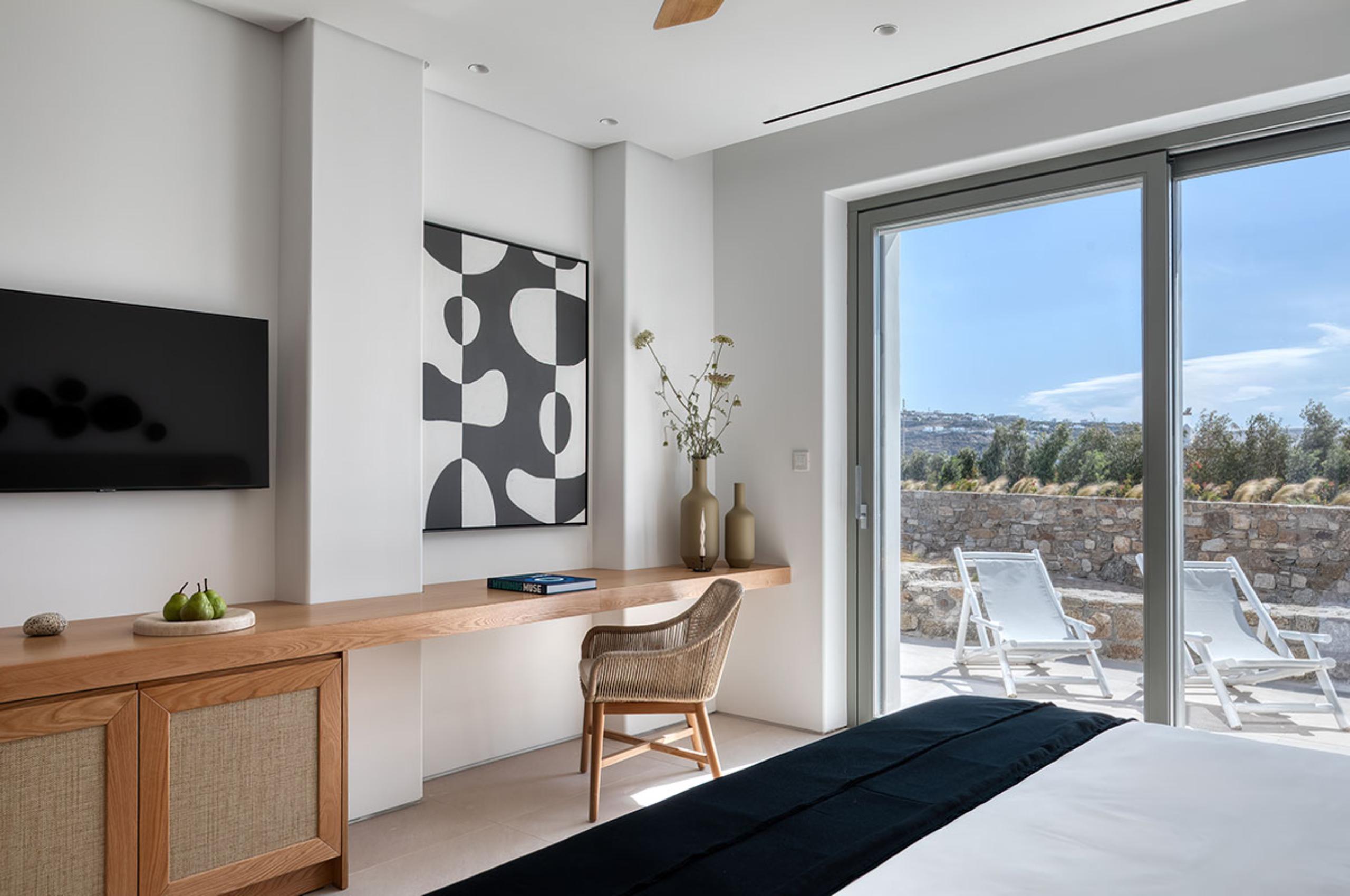 villa-theodora-bedroom-desk-terrace-artwork-tv-modern-design-luxury-mykonos