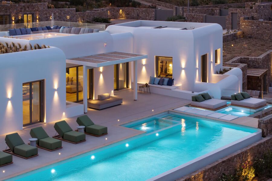 villa-theodora-exterior-night-swimming-pool-terrace-sun-beds-luxury-retreat-mykonos