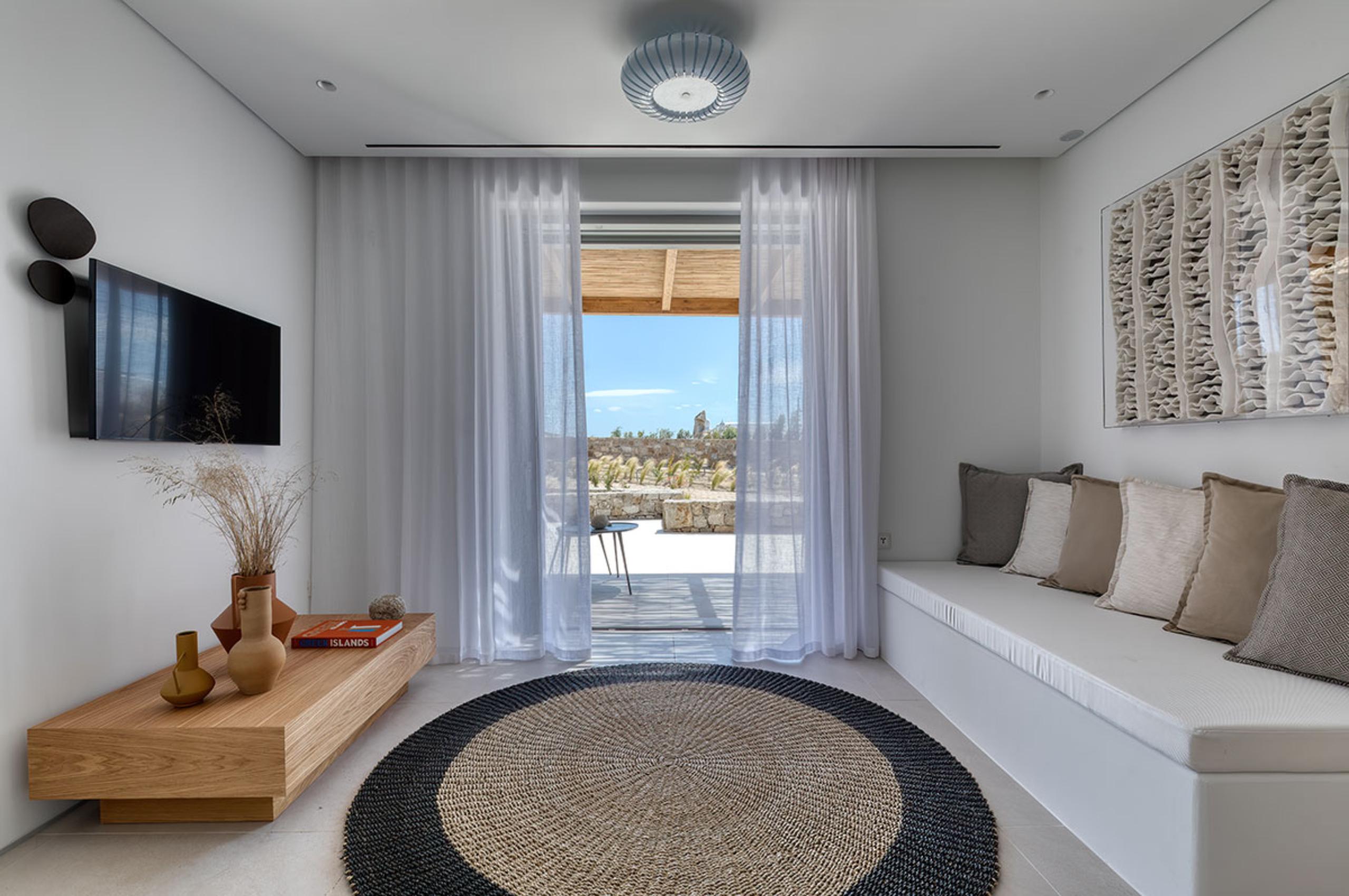 villa-theodora-living-area-terrace-access-tv-room-serene-design-relaxing-luxury-mykonos