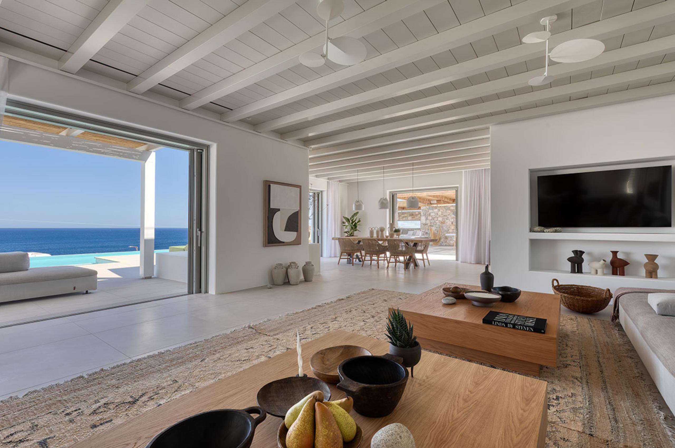villa-theodora-living-room-tv-dining-room-openplan-spacious-bright-modern-sea-view-luxury-mykonos