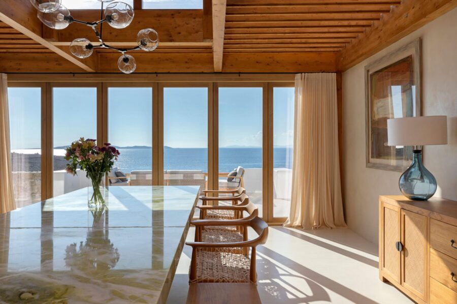 villa-zeta-dining-room-elegant-marble-table-bright-modern-interior-sea-view-luxury-mykonos