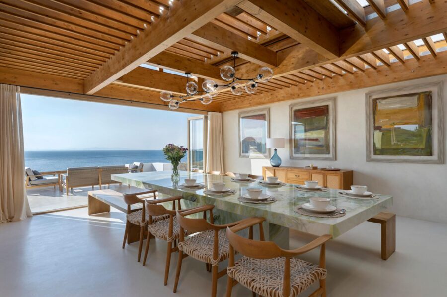 villa-zeta-dining-room-grand-marble-table-unique-artwork-sea-views-luxury-mykonos