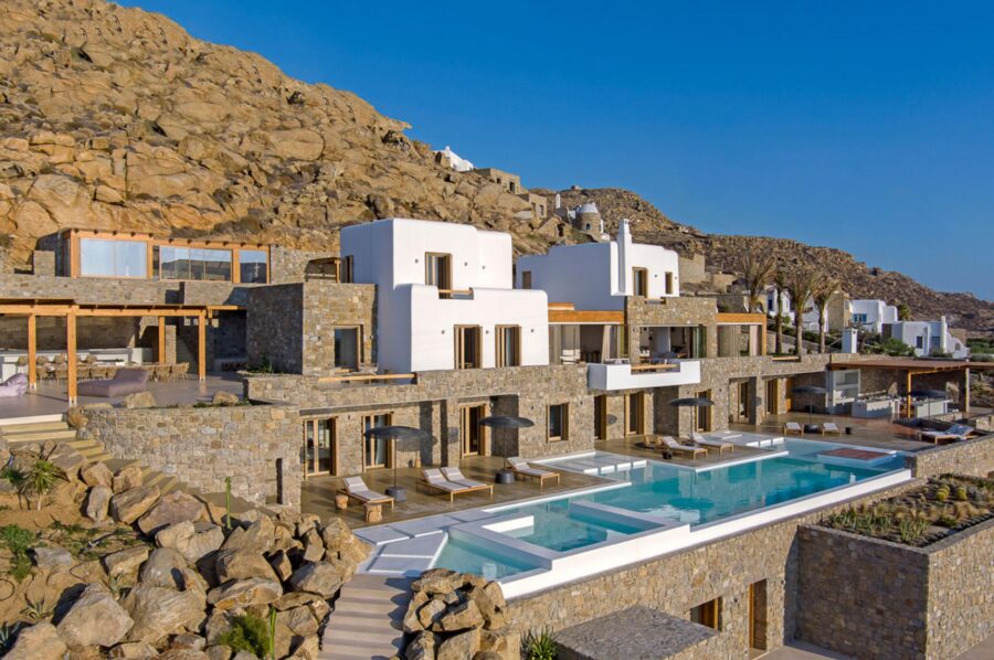 villa-zeta-exterior-infinity-swimming-pool-hillside-retreat-terraces-balconies-luxury-rental-mykonos