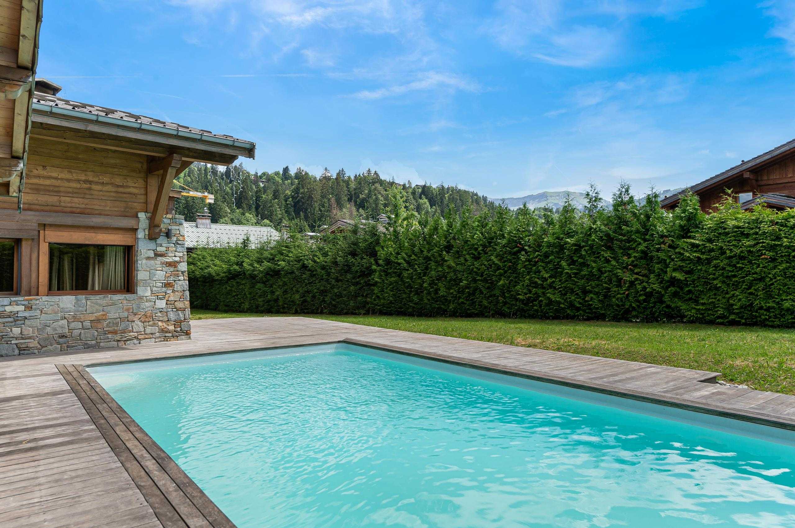 chalet-avalon-outdoor-swimming-pool-mountain-view-luxury-megeve