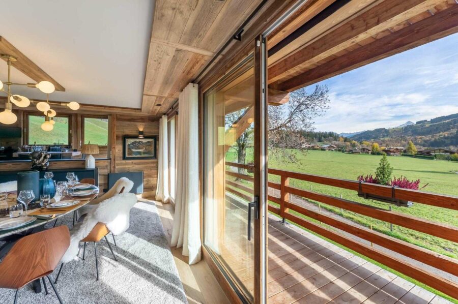 chalet-marnie-dining-area-balcony-scenic-countryside-views-luxury-megeve