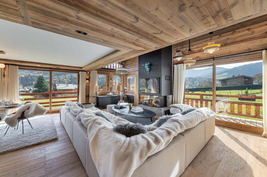chalet-marnie-living-room-fireplace-scenic-alpine-views-luxury-megeve