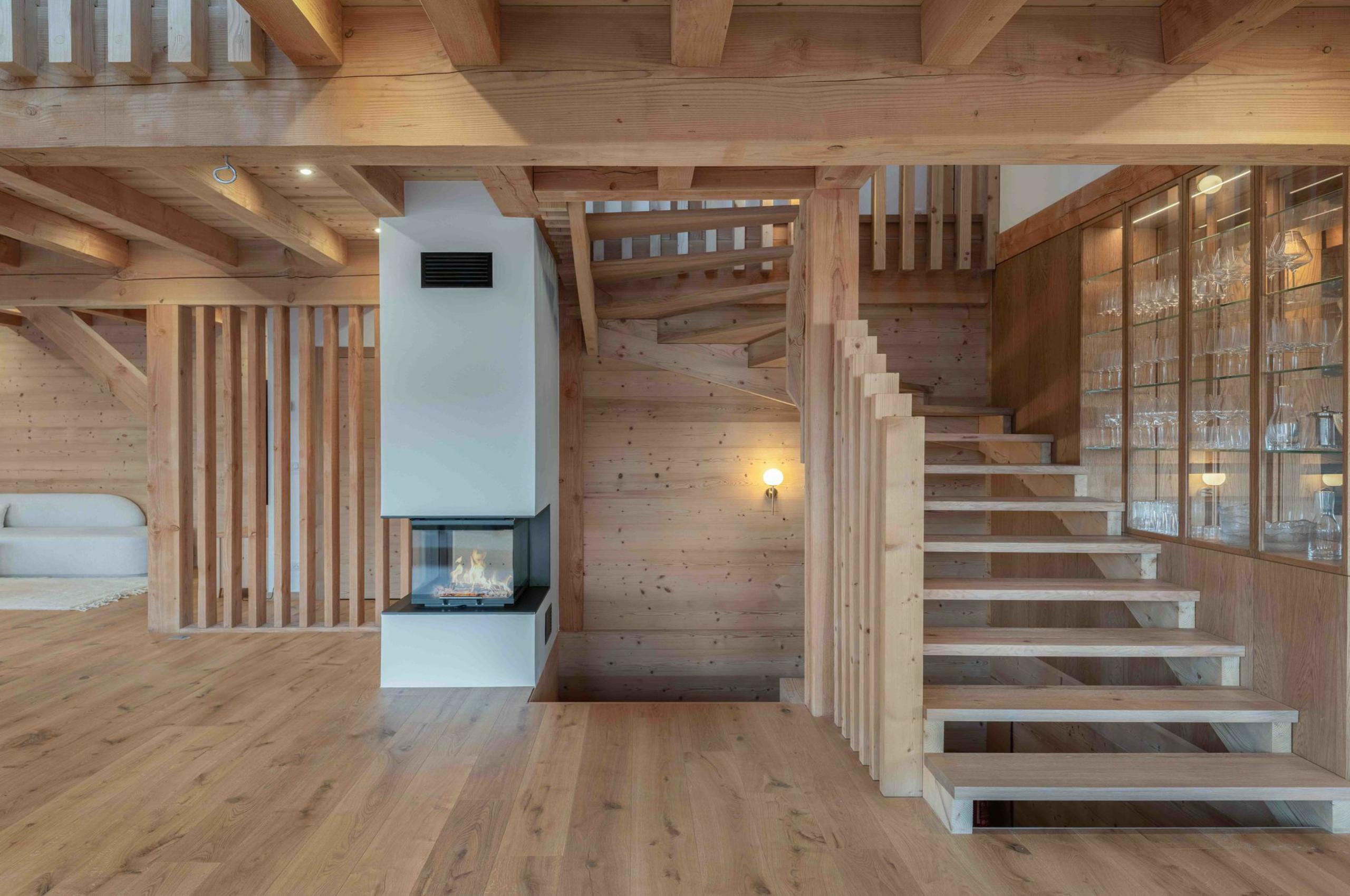 chalet-sadie-fireplace-staircase-elegant-alpine-design-luxury-megeve