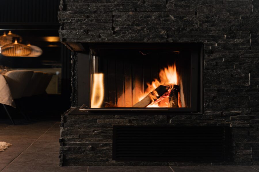 chalet-lumi-stone-fireplace-grand-warming-welcoming-interior-luxury-lapland