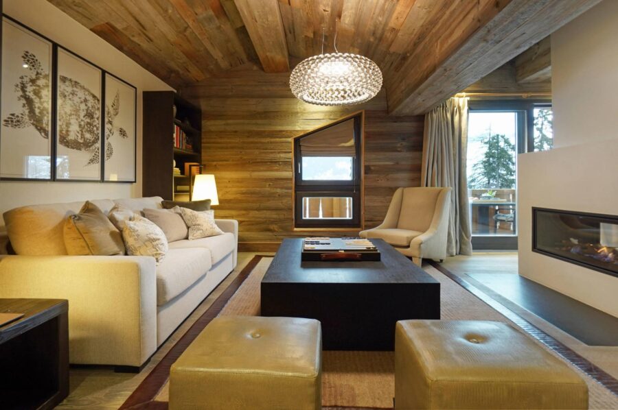 chalet-leona-master-suite-living-room-fireplace-luxury-verbier